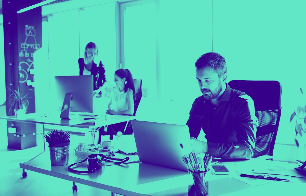 Return to office banner of people in an office working