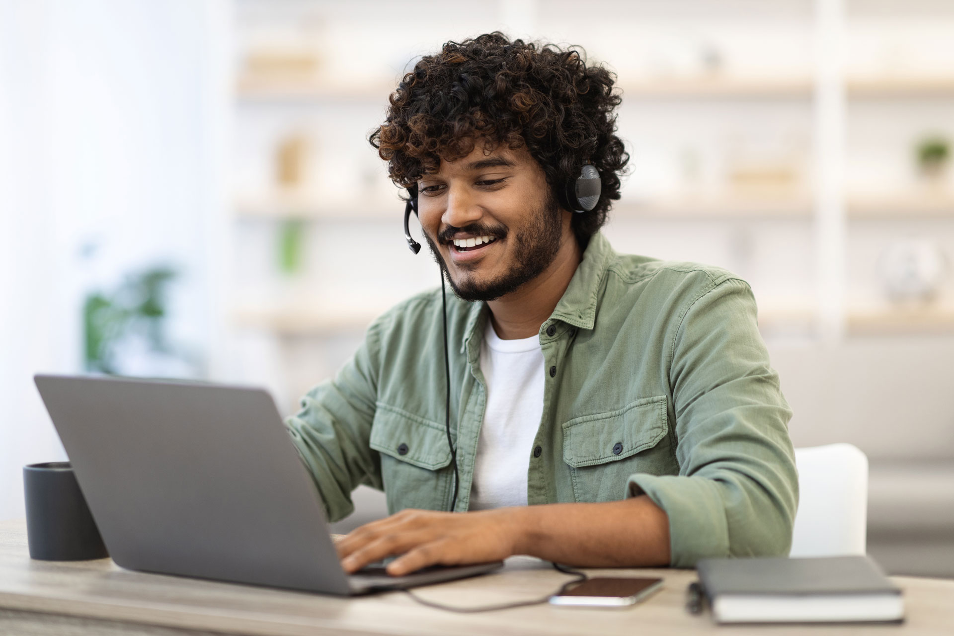 Positive Handsome Guy Working Online